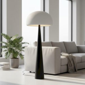 lampadaire-champignon-pied-conique-ambiance-royan Lampadaire champignon allume a cote d'un canape beige dans un salon moderne pres de Royan.