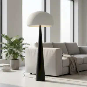 Lampadaire champignon allume a cote d'un canape beige dans un salon moderne pres de Royan.
